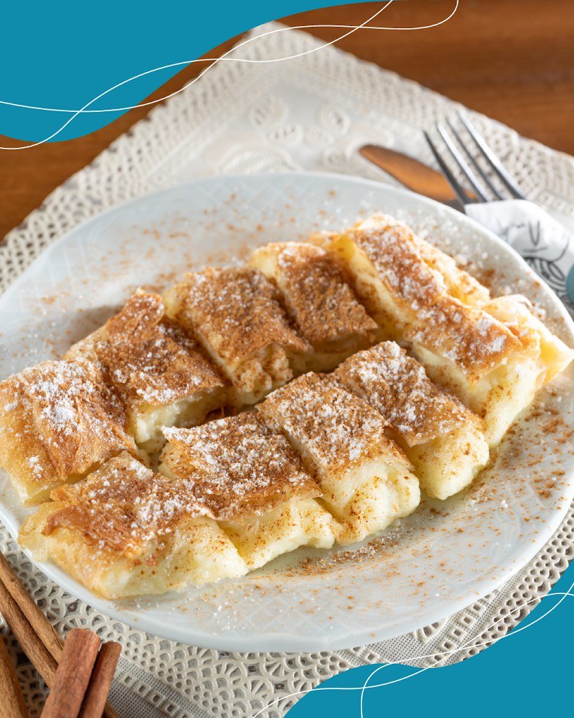 Golden bougatsa from Phyllosophies dusted with cinnamon and powdered sugar - the crispy phyllo pastry that has made this century-old Heraklion bakery famous.