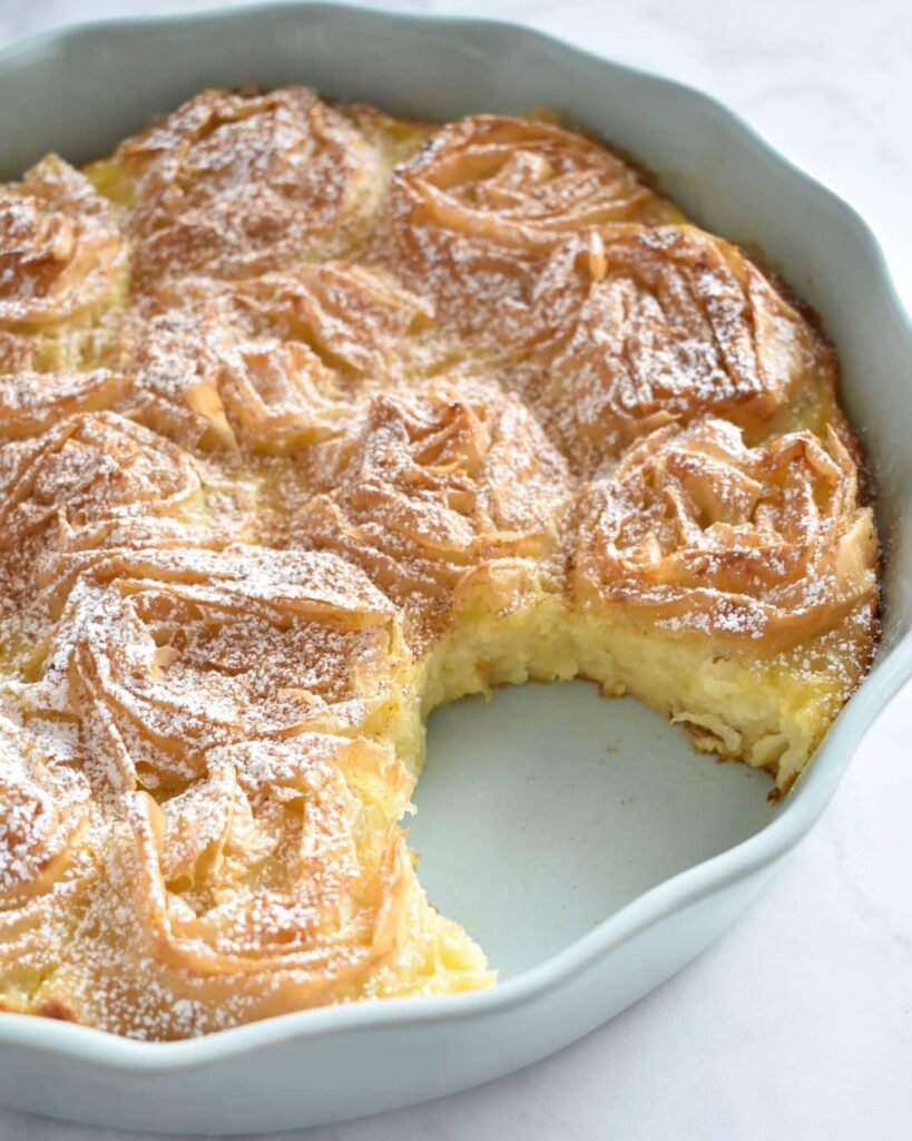 Rustic patsavouropita with its signature "ragged" phyllo layers and custard filling, creating the perfect contrast of crispy edges and soft center.