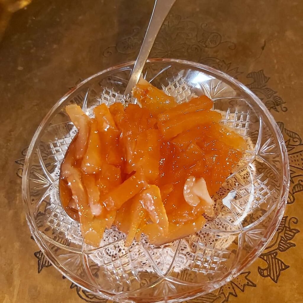 Colorful glyka tou koutaliou (spoon sweets) preserves showcasing the vibrant fruits of Crete transformed into jewel-like bites of pure flavor. 