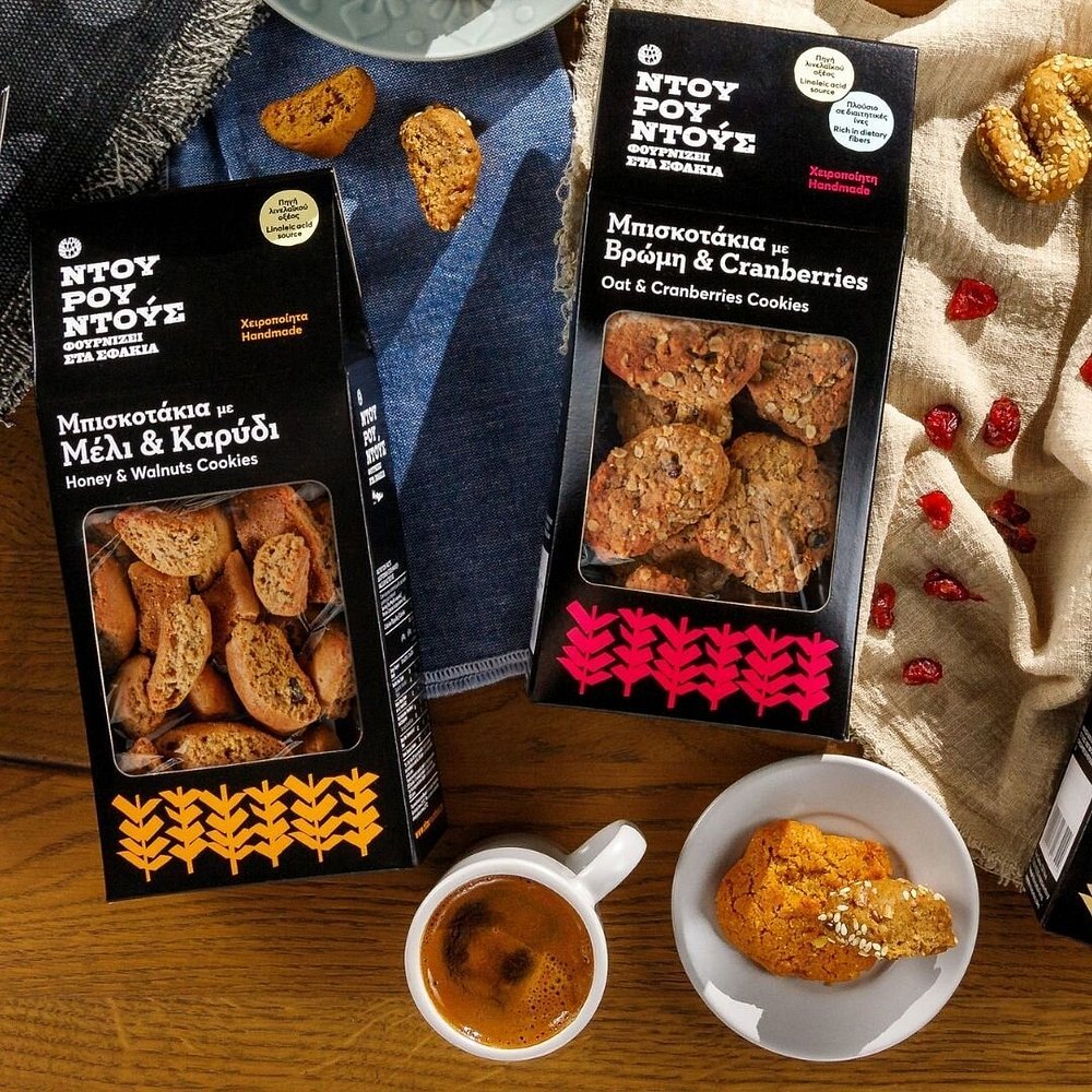 Handmade traditional cookies from Bakery Ntourountous Sfakia, including honey and walnut biscuits and oat and cranberry varieties, perfect for pairing with Greek coffee or packing for beach picnics. Photo Credit: Bakery Ntourountous Sfakia