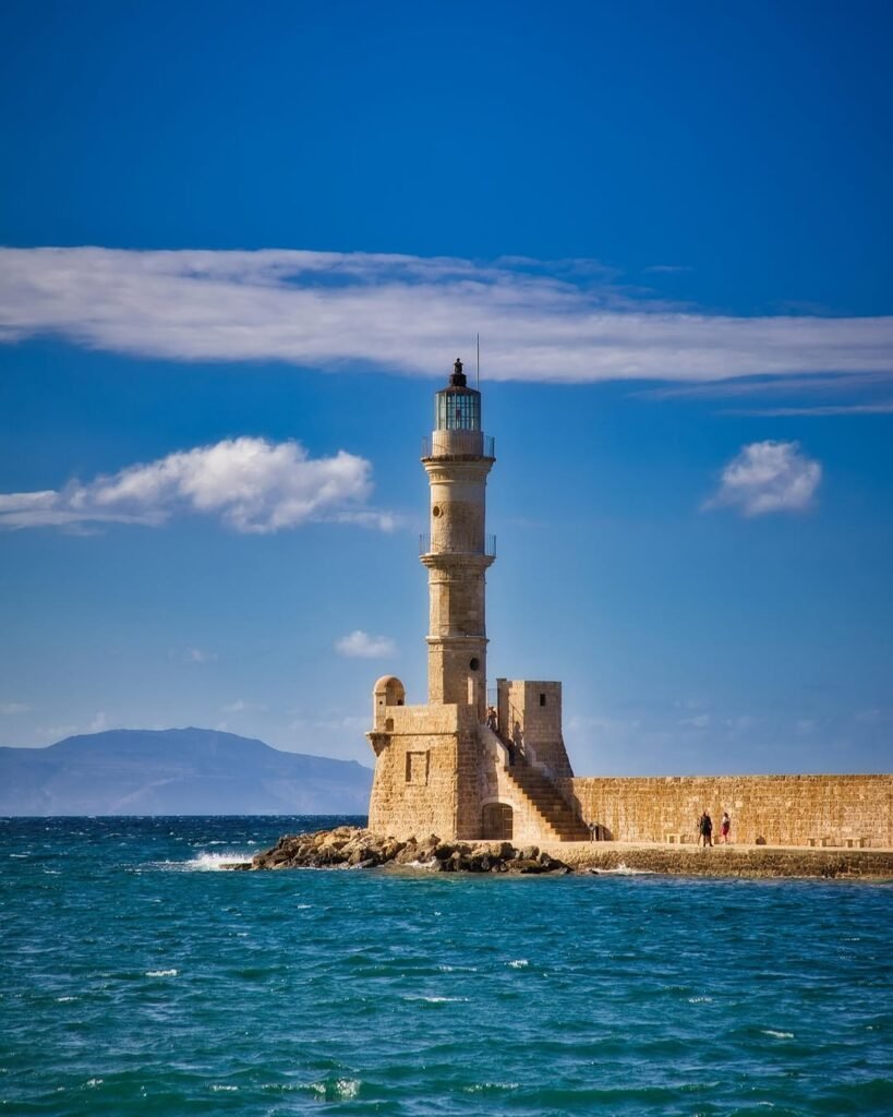 Chania's iconic lighthouse, built by the Venetians in the 16th century and rebuilt by Egyptian forces in the 19th century with its distinctive minaret-like silhouette. 