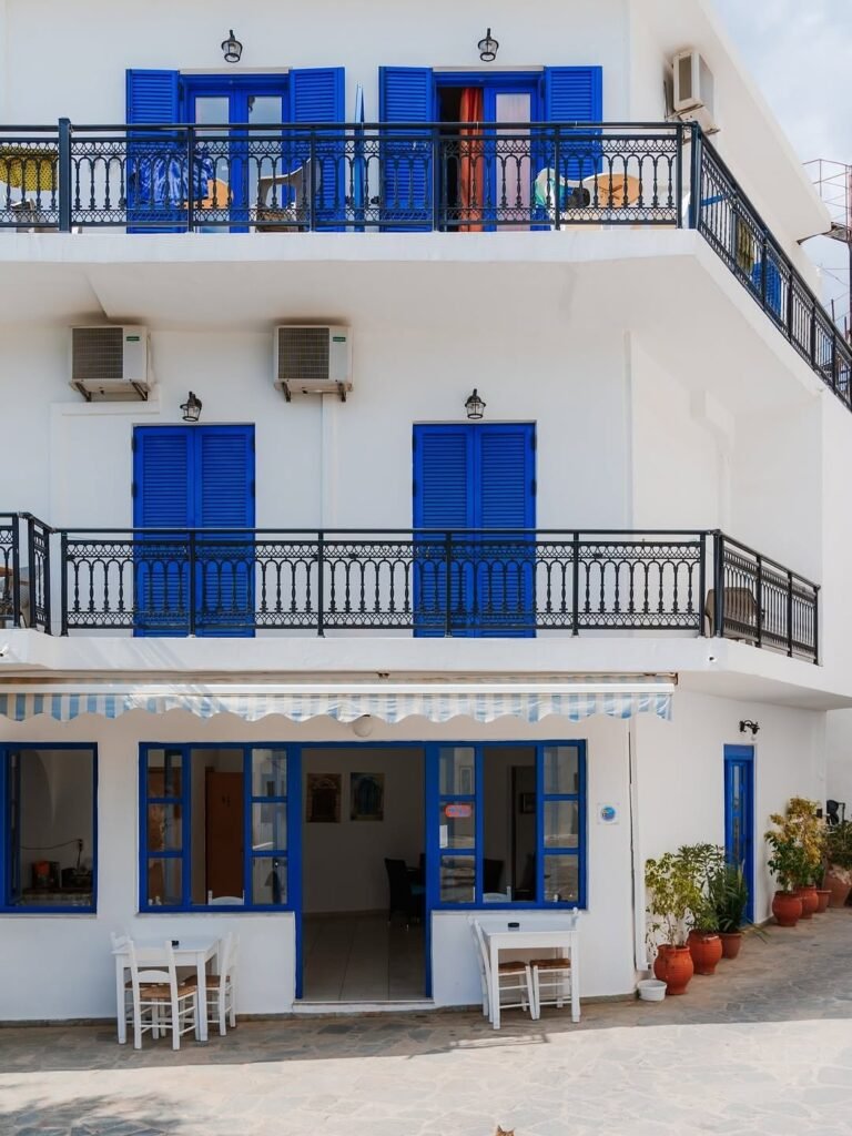Traditional whitewashed building with blue shutters in Sfakia, on Crete's south coast, Chania. Photo Credit: @mary_quincy